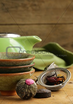 set for a traditional tea drinking (kettle, cups and green tea)