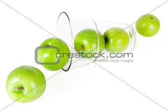 Fresh green apples with glass isolated on white