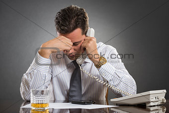 Stressed businessman with headache