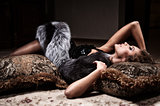 woman lying on a fur mat