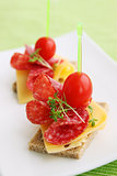 Canapes with cheese and salami