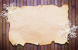 Old paper and decorative snowflakes