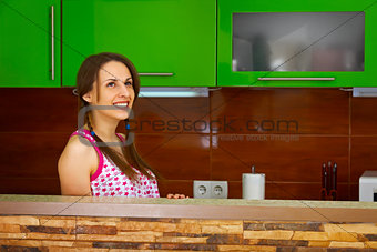 Young woman dreaming in kitchen