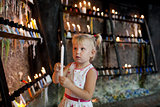 child with candles
