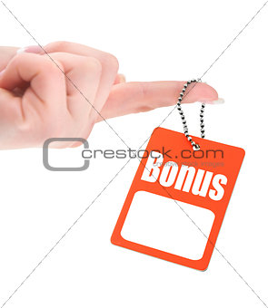 female hand holding tag with bonus inscription 