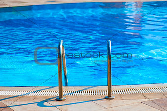 railing stairs down to the pool with fresh water