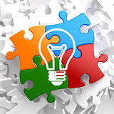 Light Bulb Icon on Multicolor Puzzle.