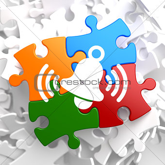 Ringing White Bell Icon on Multicolor Puzzle.