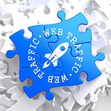 Web Traffic Concept on Blue Puzzle.