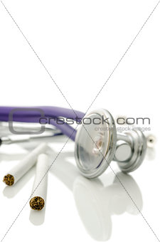 Closeup of cigarettes and stethoscope
