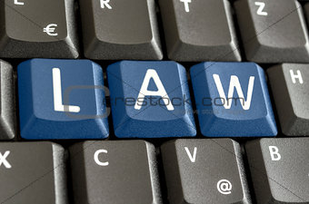 Word LAW written on computer keyboard
