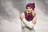winter girl in white with purple hat and scarf