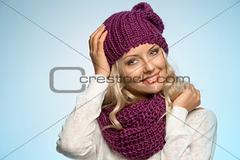 young beautiful blond wearing scarf and winter hat