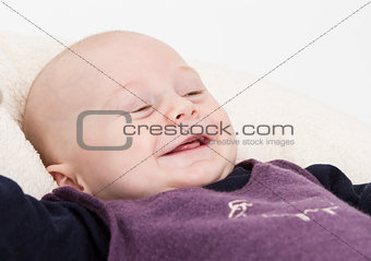smiling young child in light background