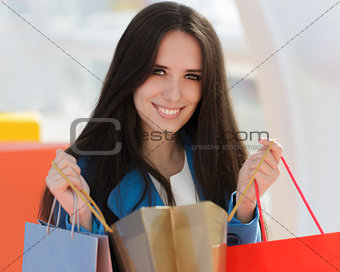 Girl with Shopping Bags Smiling