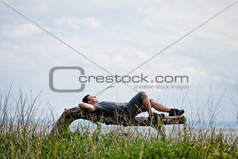 Young Adult Relaxing Peacefully in Nature