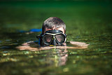 Young Adult Snorkeling in a river