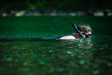 Young Adult Snorkeling in a river