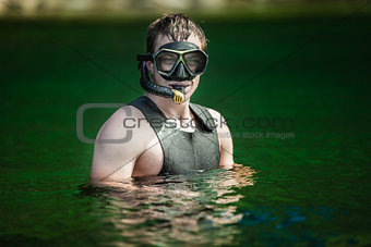 Funny Young Adult Snorkeling in a river