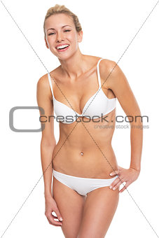 Portrait of smiling young woman in lingerie
