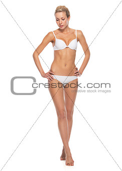 Full length portrait of young woman in lingerie