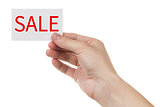 adult man hand holding card with sale promotion words
