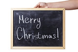 female teen hand holding chalkboard with Merry Christmas text