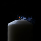 extinguished candle with blue smoke