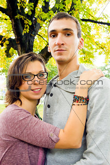 Portrait of love couple outdoor looking happy