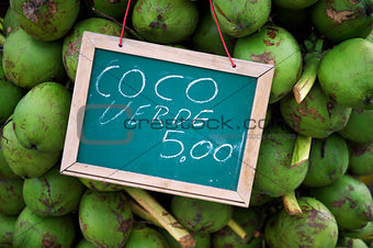 Stack of green coconuts at stall in Brazil