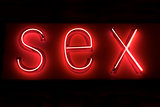 SEX hot red neon on black background