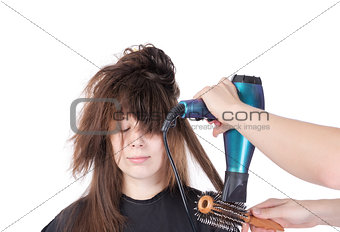 Woman enjoying having her hair blow dried