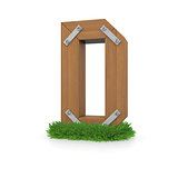 Wooden letter D in the grass