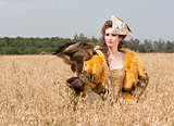 Woman with hawk on hand