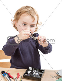 little girl repairing computer parts