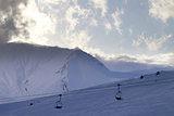 Ski slope and chair-lift in evening