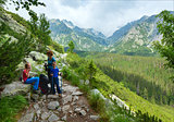 High Tatras (Slovakia) summer view and family on footway.