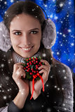 Winter Girl Holding a Christmas Decoration