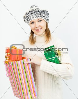Charming smiling girl holding a gift box