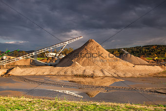 Quarry sand on a bank of a river