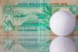 Dirhams and golf ball