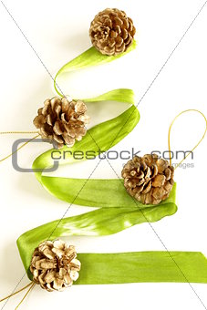 green ribbon Christmas tree with decorations on a white background