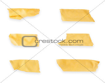 collection of various adhesive tape pieces on white background.