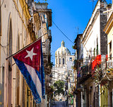 Cuban national flag with a view of the Capitol
