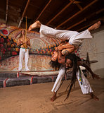 Capoeira Performers Shoulder Throw