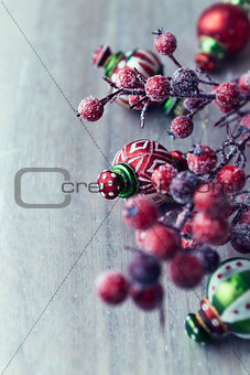 Colorful christmas decorations on wooden background