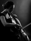 Female playing the cello black and white