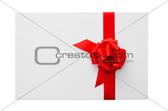 a blank card with a red ribbon bow with a copy-space