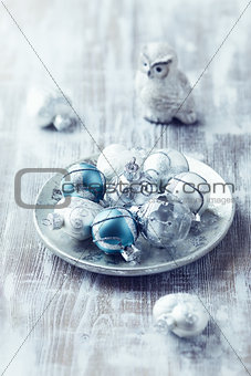 Christmas ornaments on a silver plate