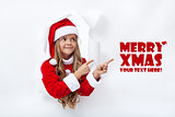 Santa girl pointig to copy space - leaning through hole in paper